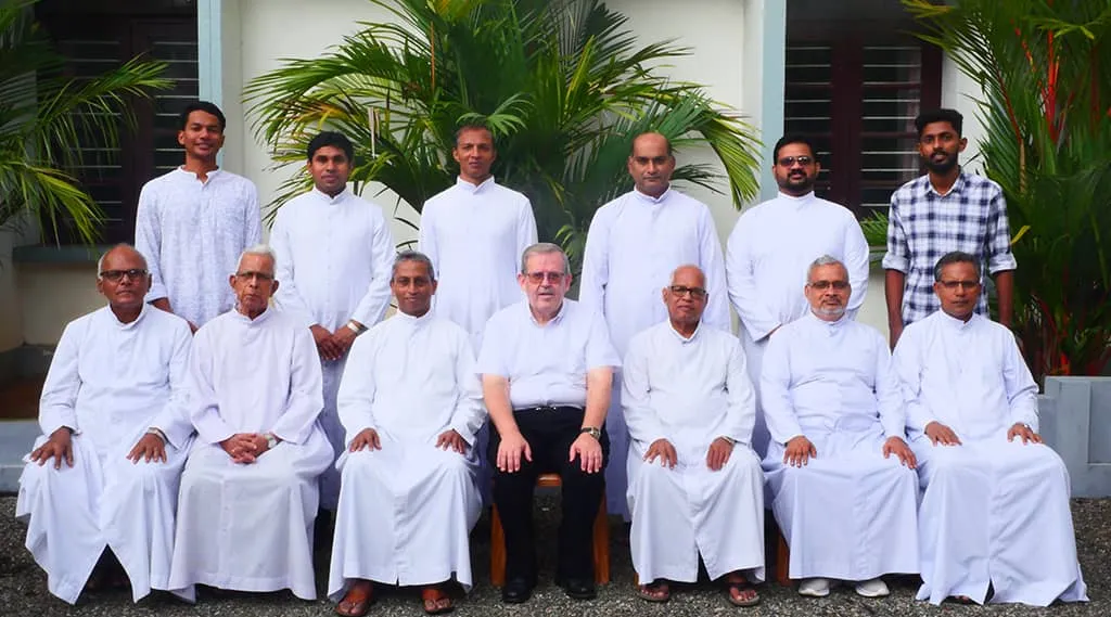 The Salesian fathers who manage Don Bosco School, Vaduthala, seated in white cassocks