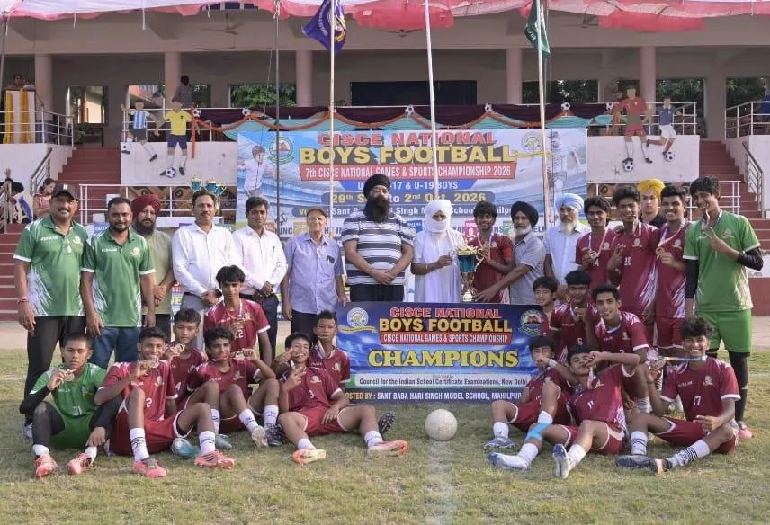 The Kerala team celebrating with the CISCE National Under-17 Boys Football champions banner